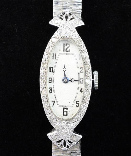 A ladys late 1920s 18ct white gold and diamond set cocktail watch,